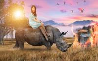 Cute girl rides the rhino